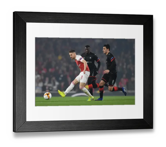 Framed Print : Aaron Ramsey (Arsenal) Clement Grenier (Rennes) Framed Print : Aaron Ramsey (Arsenal) Clement Grenier (Rennes)