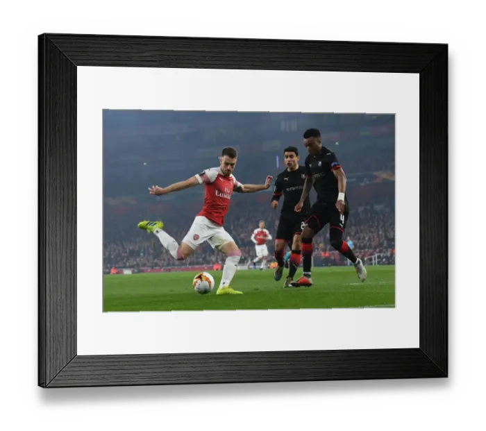 Framed Print : Aaron Ramsey vs Mexer: Intense Battle at Emirates Stadium - Arsenal vs Stade Rennais, UEFA Europa League 2019 Framed Print : Aaron Ramsey vs Mexer: Intense Battle at Emirates Stadium - Arsenal vs Stade Rennais, UEFA Europa League 2019