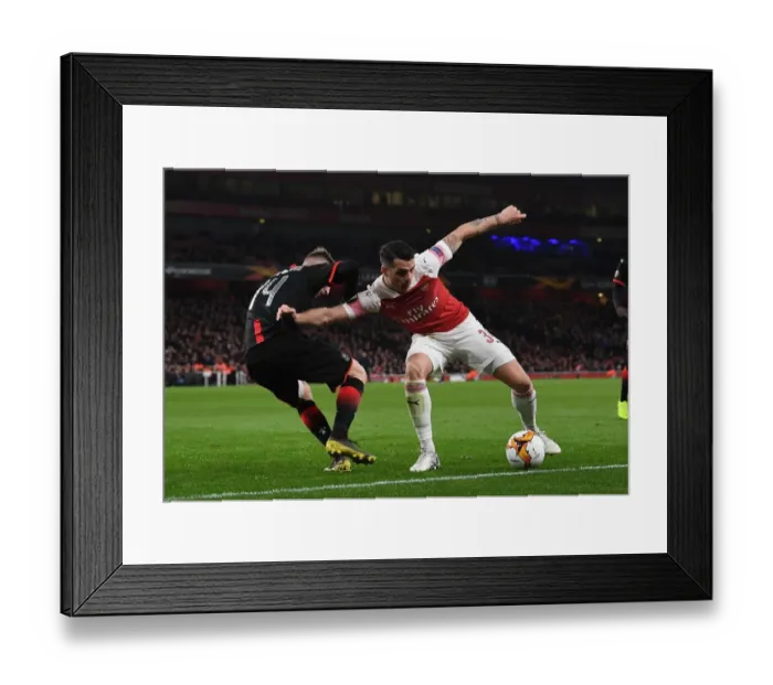 Framed Print : Xhaka vs Bourigeaud: Intense Clash in Arsenal v Stade Rennais UEFA Europa League Showdown