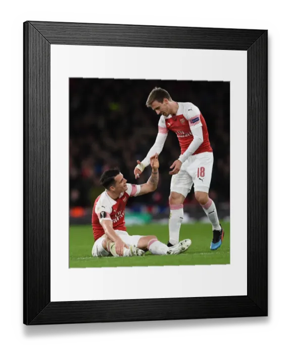Framed Print : Arsenal's Xhaka and Monreal Focused During Europa League Clash Against Stade Rennais