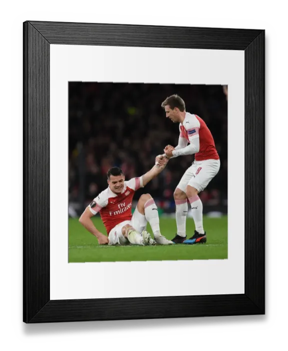 Framed Print : Arsenal's Xhaka and Monreal in Action during Europa League Clash against Stade Rennais