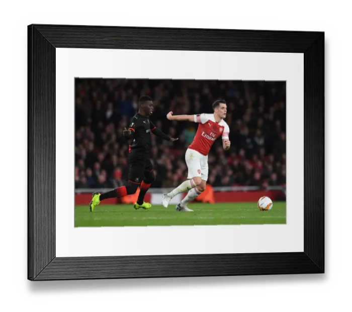 Framed Print : Xhaka vs Sarr: Battle in the Europa League as Arsenal Face Stade Rennais Framed Print : Xhaka vs Sarr: Battle in the Europa League as Arsenal Face Stade Rennais
