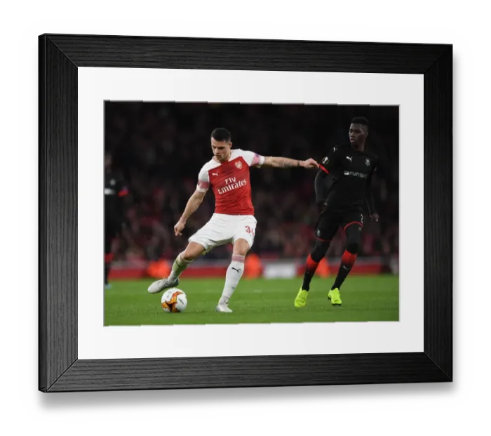 Framed Print : Xhaka vs Sarr: Battle in the Europa League Clash Between Arsenal and Stade Rennais