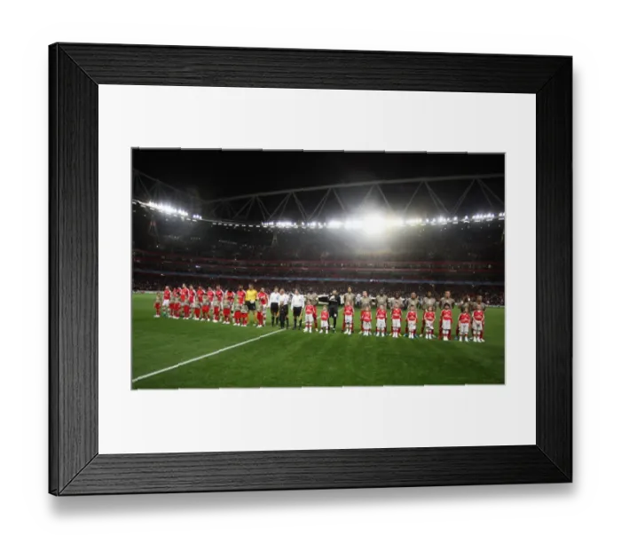 Framed Print : The Arsenal and Liege teams line up with their mascots Framed Print : The Arsenal and Liege teams line up with their mascots
