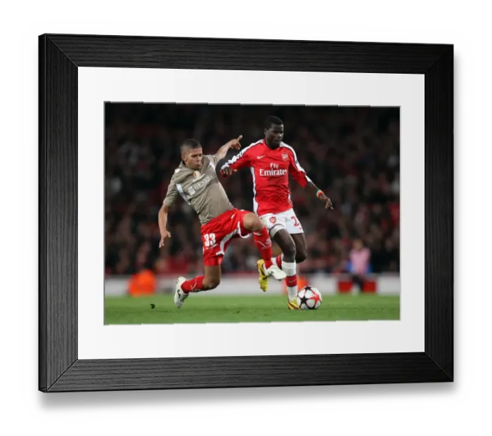 Framed Print : Arsenal's Eboue and Carcela-Gonzalez Shine in 2:0 UEFA Champions League Victory over Standard Liege Framed Print : Arsenal's Eboue and Carcela-Gonzalez Shine in 2:0 UEFA Champions League Victory over Standard Liege