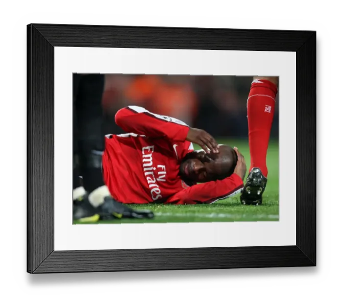 Framed Print : William Gallas in Pain: Arsenal's Clash of Heads with Andrey Arshavin during UEFA Champions League Match vs Standard Liege Framed Print : William Gallas in Pain: Arsenal's Clash of Heads with Andrey Arshavin during UEFA Champions League Match vs Standard Liege