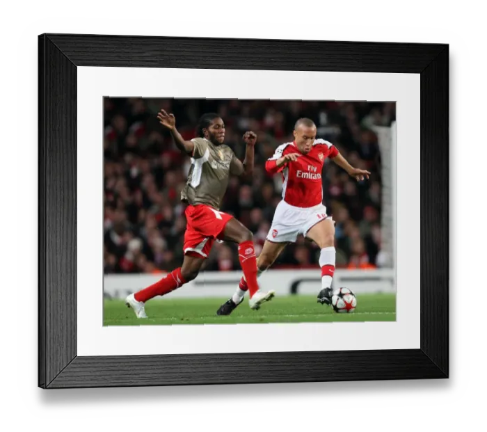 Framed Print : Mikael Silvestre (Arsenal) Dieudonne Mbokani (Liege)