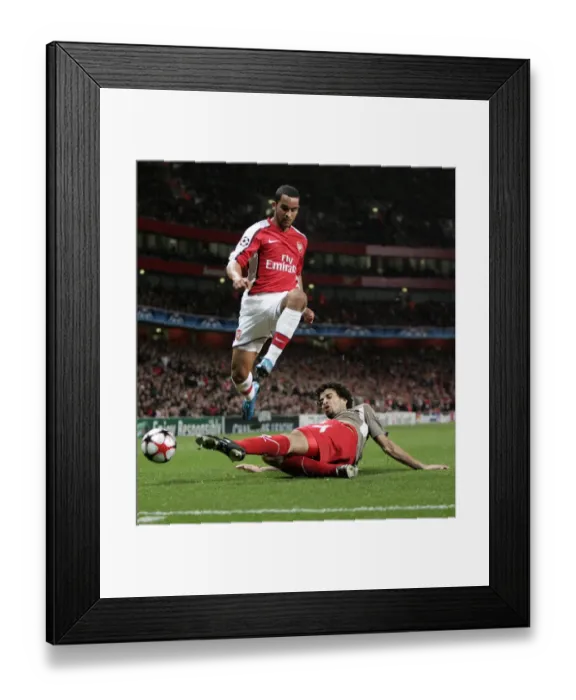 Framed Print : Theo Walcott (Arsenal) Felipe (Liege) Framed Print : Theo Walcott (Arsenal) Felipe (Liege)