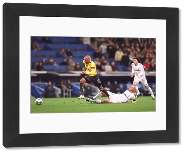 Thierry Henry beats Guti (Real) on his way to scoring Arsenals goal
