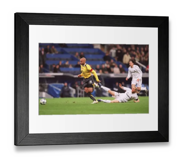 Framed Print : Thierry Henry's Iconic Goal: Arsenal's Historic 1-0 Victory Over Real Madrid in the 2006 Champions League Framed Print : Thierry Henry's Iconic Goal: Arsenal's Historic 1-0 Victory Over Real Madrid in the 2006 Champions League
