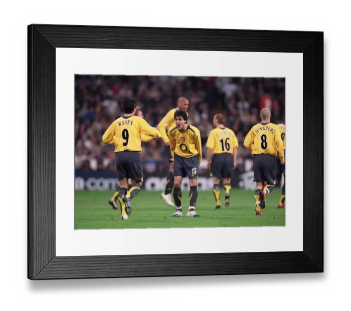 Framed Print : Cesc Fabregas celebrates Arsenals goal with Jose Reyes