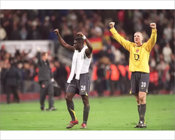 Kolo Toure and Philippe Senderos (Arsenal) celebrate infront of the Arsenal fans at the end of the m