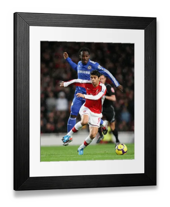 Framed Print : Eduardo (Arsenal) Michael Essien (Chelsea). Arsenal 0: 3 Chelsea. Barclays Premier League