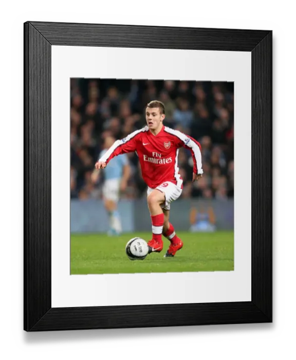 Framed Print : Jack Wilshere's Brave Performance Amidst Manchester City's 3-0 Victory in the Carling Cup 5th Round