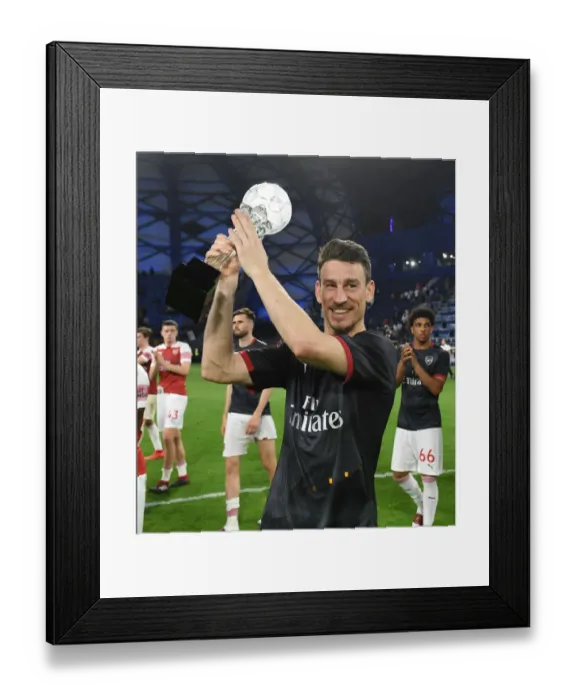 Framed Print : Laurent Koscielny: Reflective Moment after Arsenal's Match at Al-Nasr Dubai SC, 2019