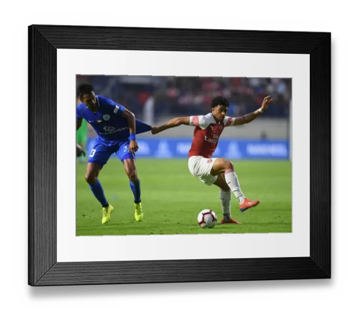 Framed Print : Arsenal's Xavier Amaechi Faces Off Against Al-Nasr's JR. Dutra in Friendly Match Framed Print : Arsenal's Xavier Amaechi Faces Off Against Al-Nasr's JR. Dutra in Friendly Match
