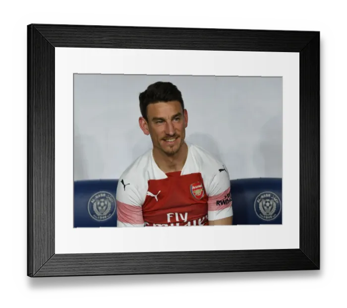 Framed Print : Laurent Koscielny in Action: Arsenal vs Al-Nasr Dubai SC (2018-19)