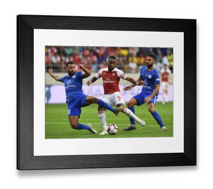Framed Print : Alexandre Lacazette Faces Off Against Masoud Sulaiman in Al-Nasr Dubai SC vs Arsenal Friendly Framed Print : Alexandre Lacazette Faces Off Against Masoud Sulaiman in Al-Nasr Dubai SC vs Arsenal Friendly