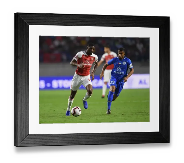 Framed Print : Clash in Dubai: Al-Nasr vs. Arsenal - Maitland-Niles Faces Off Against Ali Hussain Framed Print : Clash in Dubai: Al-Nasr vs. Arsenal - Maitland-Niles Faces Off Against Ali Hussain