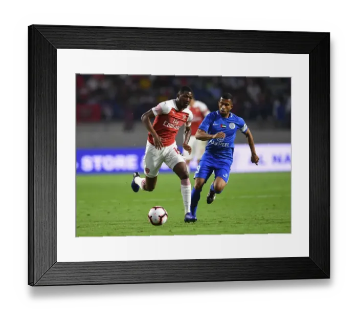 Framed Print : Al-Nasr Dubai SC vs. Arsenal: Ainsley Maitland-Niles Faces Off Against Ali Hussain Framed Print : Al-Nasr Dubai SC vs. Arsenal: Ainsley Maitland-Niles Faces Off Against Ali Hussain