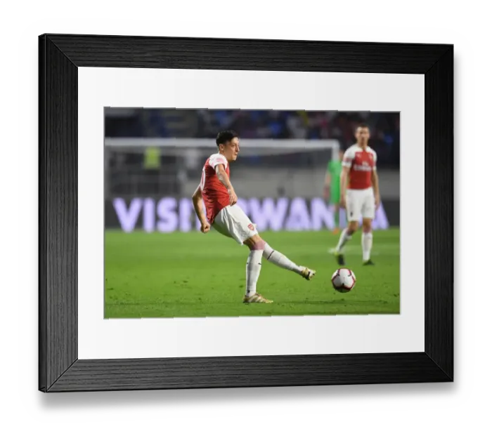 Framed Print : Mesut Ozil of Arsenal during the match between Al-Nasr Duabi SC and Arsenal at Al Maktoum Stadium on March 26