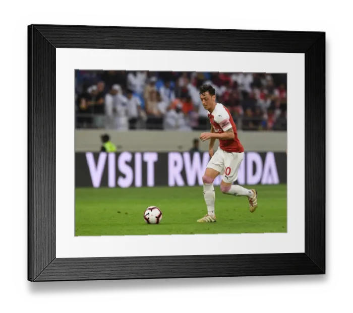 Framed Print : Mesut Ozil of Arsenal during the match between Al-Nasr Duabi SC and Arsenal at Al Maktoum Stadium on March 26 Framed Print : Mesut Ozil of Arsenal during the match between Al-Nasr Duabi SC and Arsenal at Al Maktoum Stadium on March 26