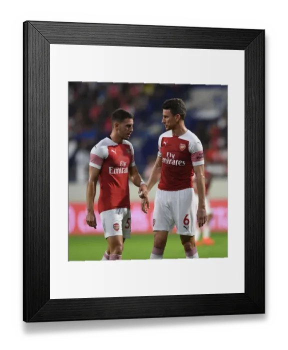 Framed Print : Arsenal's Koscielny and Pleguezuelo in Action against Al-Nasr Dubai SC Framed Print : Arsenal's Koscielny and Pleguezuelo in Action against Al-Nasr Dubai SC
