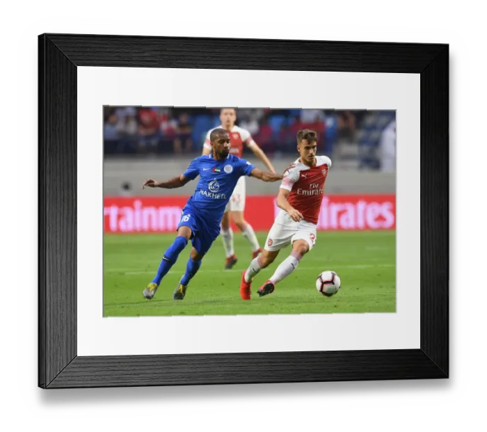 Framed Print : Denis Suarez vs. Amer Mubarak: Clash in the Desert - Al-Nasr Dubai SC vs. Arsenal (Friendly, 2019)