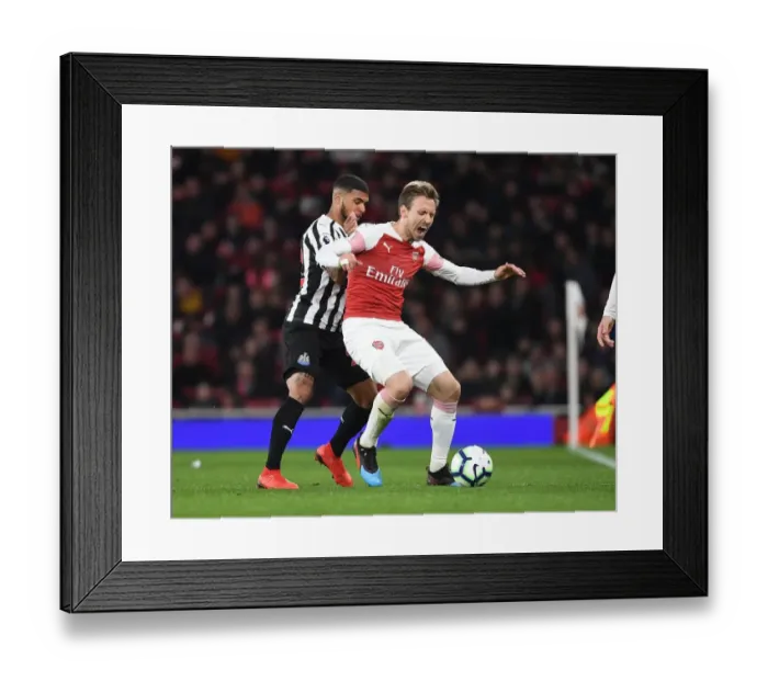 Framed Print : Arsenal vs. Newcastle United: Monreal vs. Yedlin in Intense Premier League Clash
