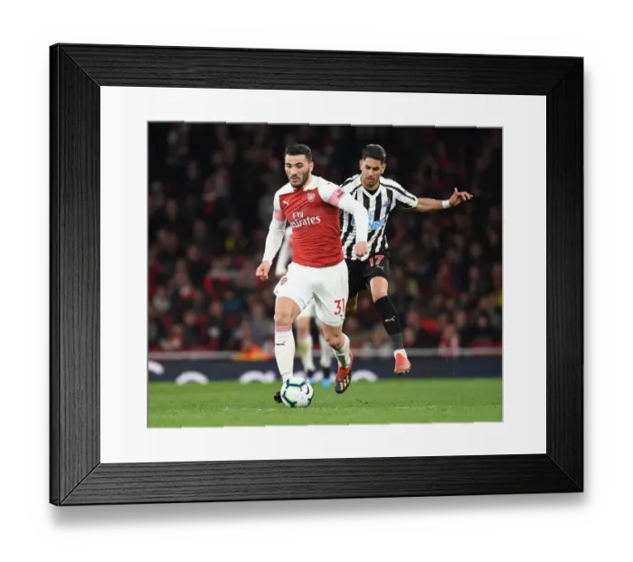 Framed Print : Arsenal's Sead Kolasinac Outmuscles Newcastle's Ayoze Perez in Premier League Clash Framed Print : Arsenal's Sead Kolasinac Outmuscles Newcastle's Ayoze Perez in Premier League Clash