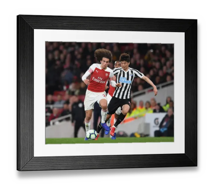 Framed Print : Arsenal's Guendouzi Clashes with Newcastle's Ki in Premier League Showdown