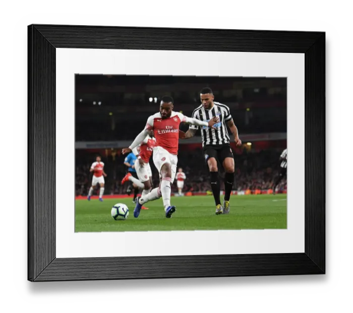 Framed Print : Arsenal's Lacazette Clashes with Newcastle's Lascelles in Premier League Showdown Framed Print : Arsenal's Lacazette Clashes with Newcastle's Lascelles in Premier League Showdown