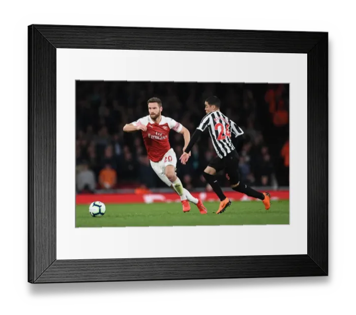 Framed Print : Mustafi Outmuscles Almiron: Intense Moment from Arsenal vs Newcastle Premier League Clash