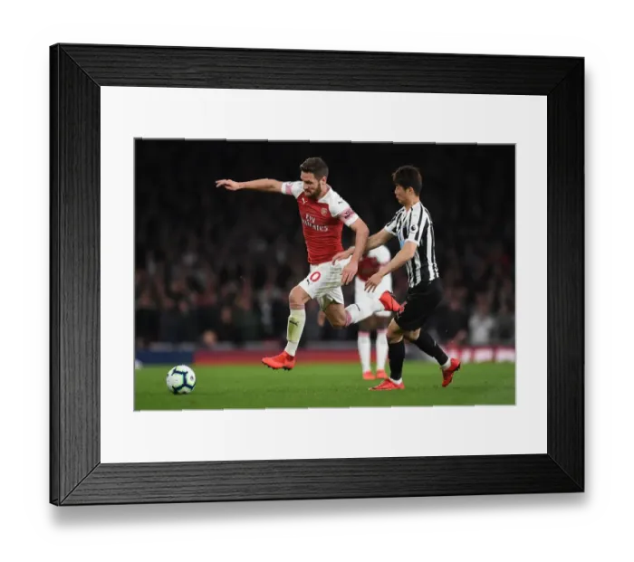 Framed Print : Mustafi Outmaneuvers Ki: Intense Moment from Arsenal vs Newcastle Premier League Clash Framed Print : Mustafi Outmaneuvers Ki: Intense Moment from Arsenal vs Newcastle Premier League Clash