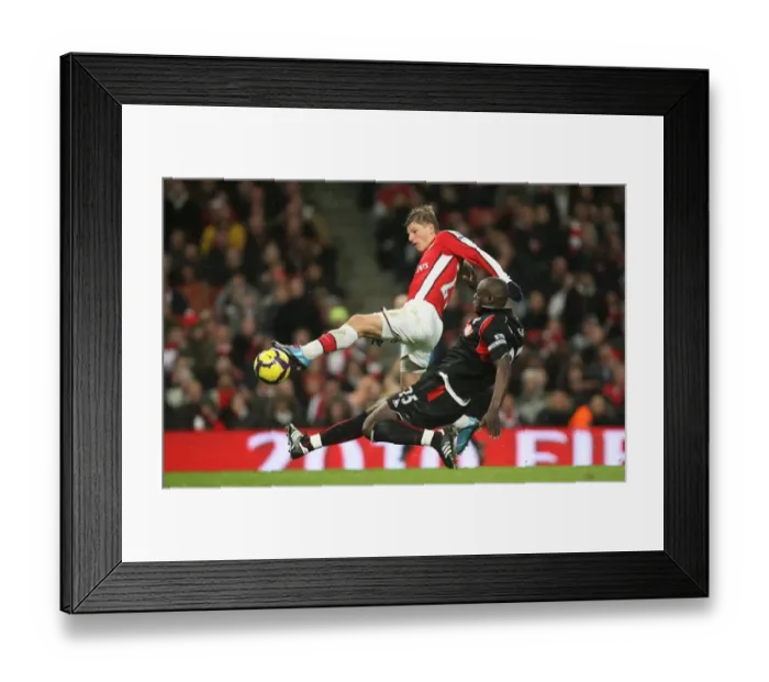 Framed Print : Andrey Arshavin (Arsenal) Abdoulaye Faye (Stoke). Arsenal 2: 0 Stoke City