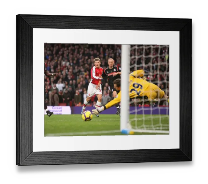 Framed Print : Andrey Arshavin shoots past Stoke City goalkeeper Thomas Sorensen to score the 1st Arsenal goal Framed Print : Andrey Arshavin shoots past Stoke City goalkeeper Thomas Sorensen to score the 1st Arsenal goal