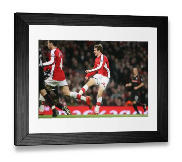 Framed Print : Aaron Ramsey shoots past Stoke goalkeeper Thomas Sorensen to score the 2nd Arsenal goal Framed Print : Aaron Ramsey shoots past Stoke goalkeeper Thomas Sorensen to score the 2nd Arsenal goal