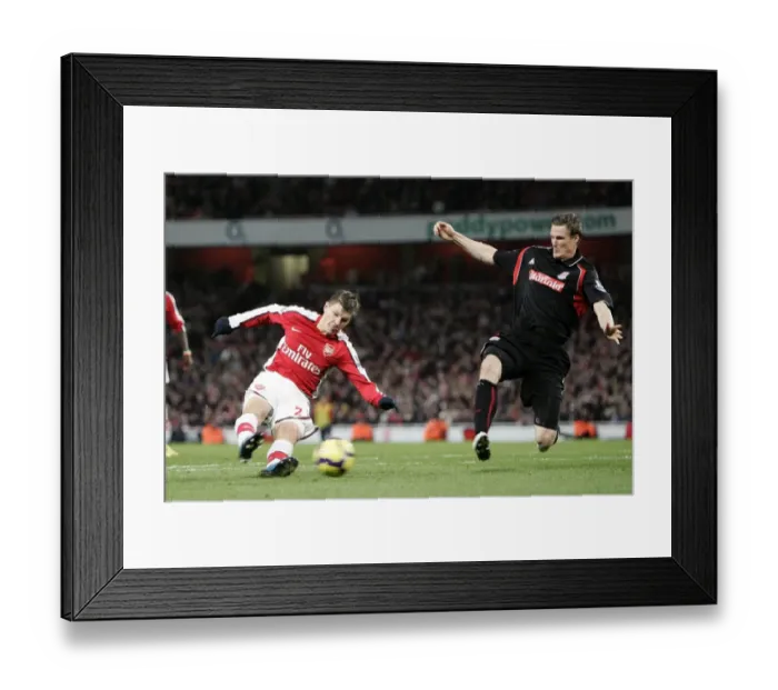 Framed Print : Andrey Arshavin (Arsenal) Robert Huth (Stoke). Arsenal 2: 0 Stoke City. Barclays Premier League