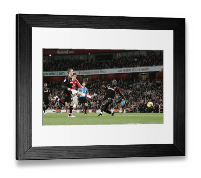 Framed Print : Aaron Ramsey scores Arsenals 2nd goal under pressure from Abdoulaye Faye Framed Print : Aaron Ramsey scores Arsenals 2nd goal under pressure from Abdoulaye Faye