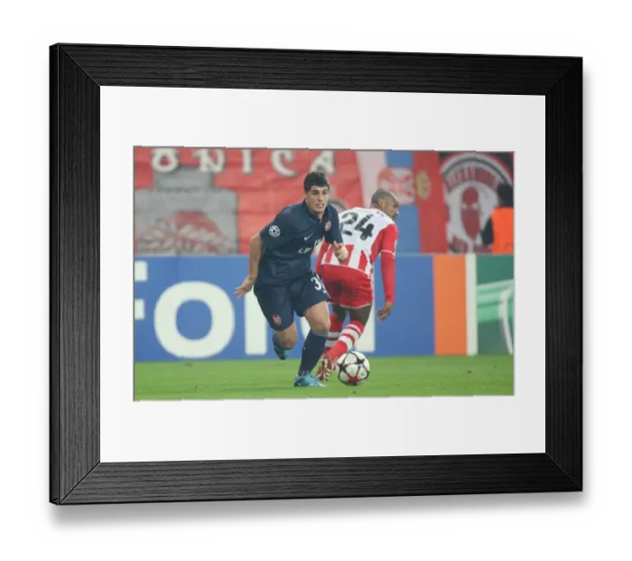 Framed Print : Fran Merida (Arsenal) Leonardo (Olympiacos). Olympiacos 1: 0 Arsenal, UEFA Champions League