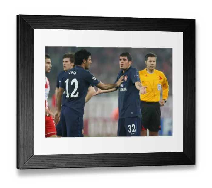 Framed Print : Fran Merida and Carlos Vela (Arsenal). Olympiacos 1: 0 Arsenal, UEFA Champions League