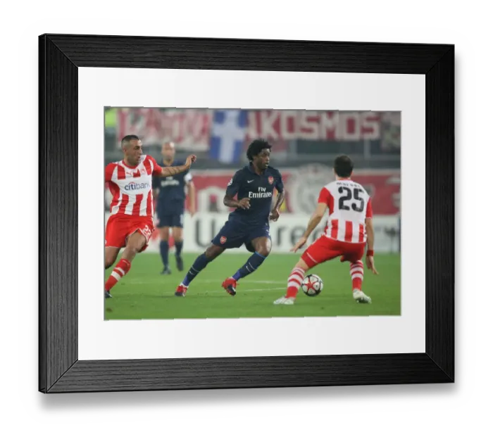 Framed Print : Alex Song (Arsenal) Kostas Mitroglou and Enzo Maresca (Olympiacos). Olympiacos 1 Framed Print : Alex Song (Arsenal) Kostas Mitroglou and Enzo Maresca (Olympiacos). Olympiacos 1
