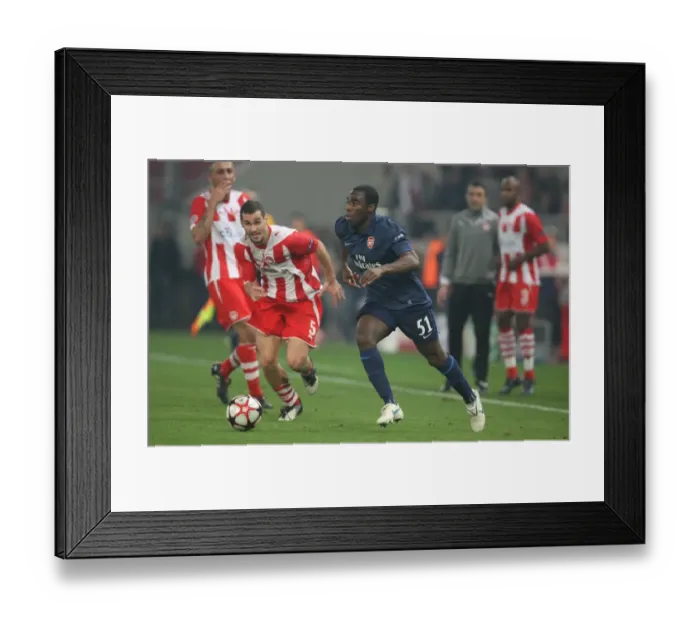 Framed Print : Sunu Shines: Arsenal's Victory Over Olympiacos (Gilles Sunu vs Giorgos Galitsios, 2009-10 UEFA Champions League)