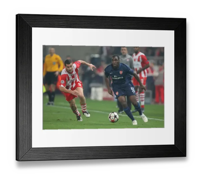 Framed Print : Gilles Sunu (Arsenal) Giorgos Galitsios (Olympiacos). Olympiacos 1: 0 Arsenal
