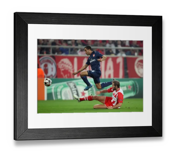 Framed Print : Theo Walcott (Arsenal) Olof Mellberg (Olympiacos). Olympiacos 1: 0 Arsenal Framed Print : Theo Walcott (Arsenal) Olof Mellberg (Olympiacos). Olympiacos 1: 0 Arsenal
