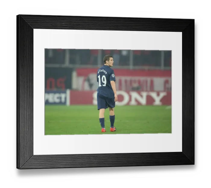 Framed Print : Jack Wilshere's Victory: Arsenal at Olympiacos, UEFA Champions League 2009-10
