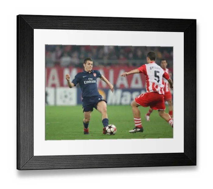 Framed Print : Jack Wilshere (Arsenal) Giorgos Galitsios (Olympiacos). Olympiacos 1: 0 Arsenal Framed Print : Jack Wilshere (Arsenal) Giorgos Galitsios (Olympiacos). Olympiacos 1: 0 Arsenal