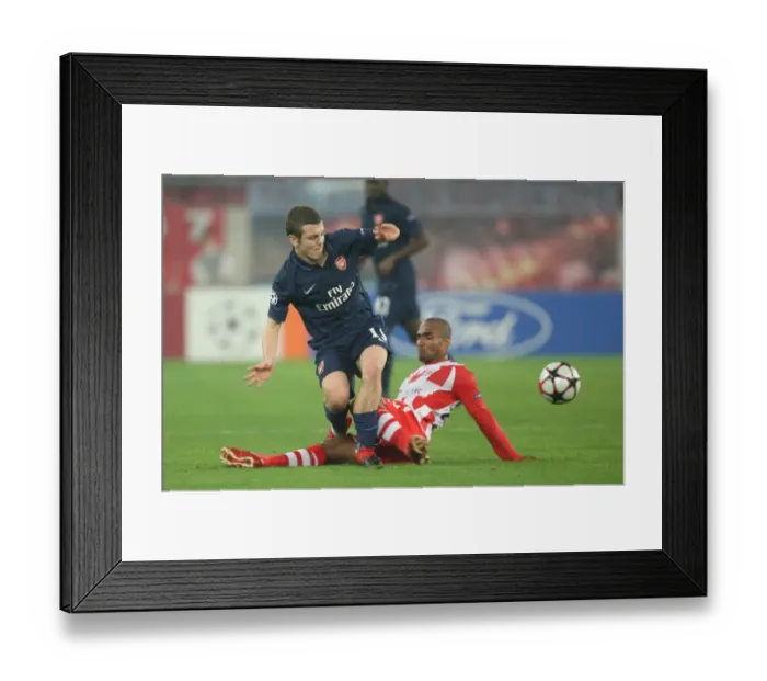 Framed Print : Jack Wilshere (Arsenal) Leonardo (Olympiacos). Olympiacos 1: 0 Arsenal, UEFA Champions League