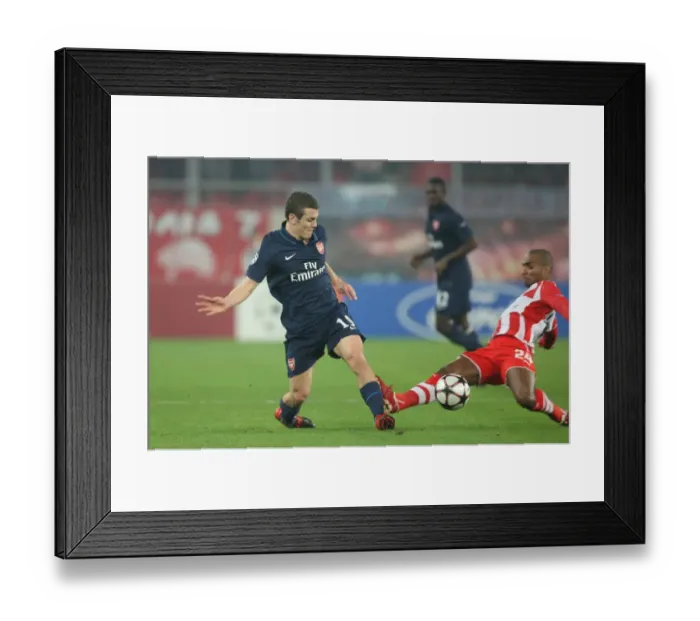 Framed Print : Jack Wilshere's Brilliant Performance: Arsenal's 1-0 Victory Over Olympiacos (Leonardo) in UEFA Champions League (Group H, 2009)