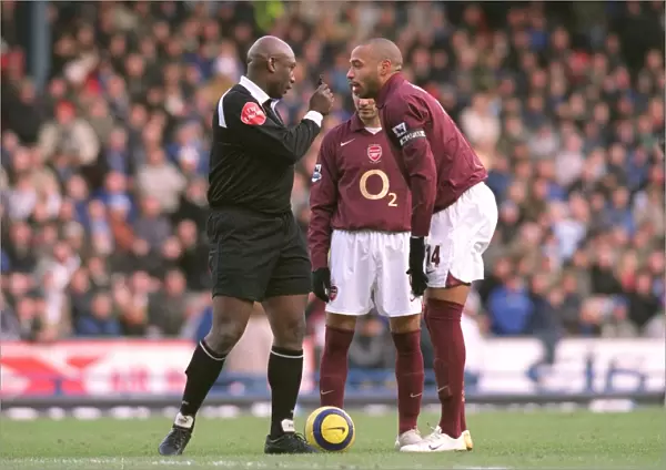 Thierry Henry (Arsenal) is told to wait for the whistle by Referee U. Rennie